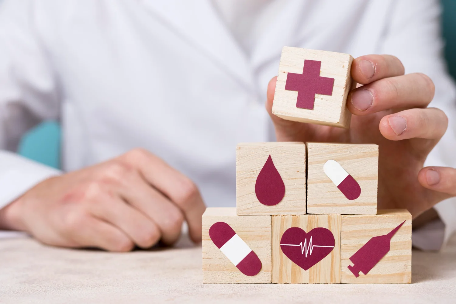 A male doctor speaking with a young patient in a medical clinic